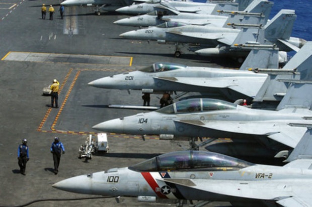 FILE –  F18 fighter jets on the deck of the USS Carl Vinson (AP Photo)